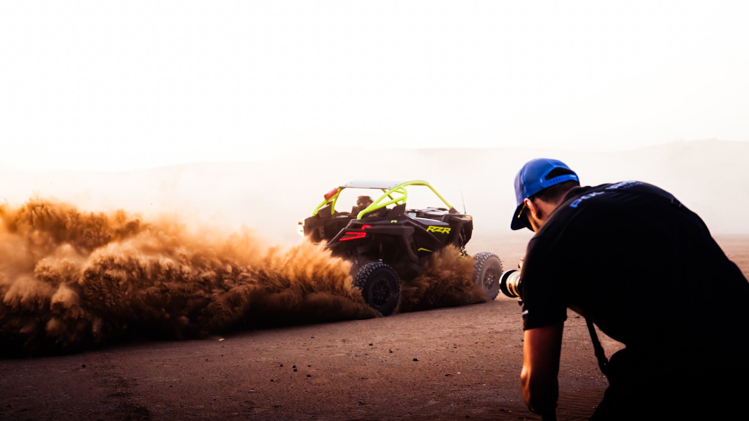 On set — filming a Polaris RZR as it throws up a wall of dust