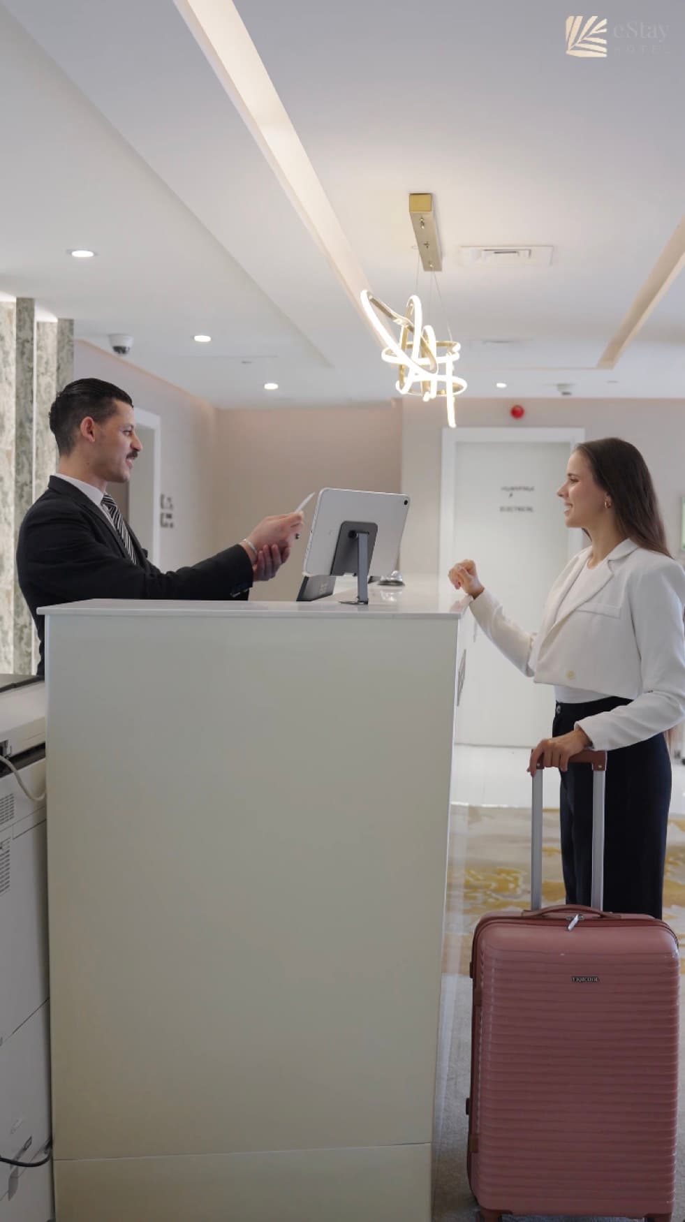 E& stay Hotel — Check-in at the reception desk
