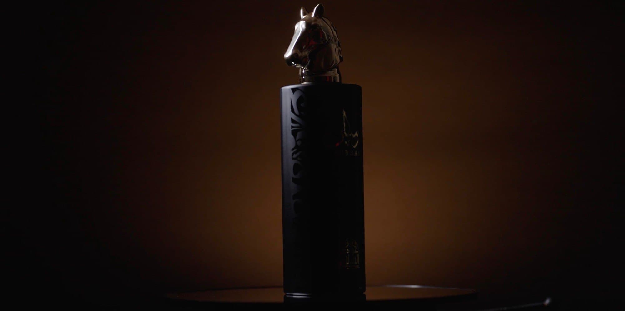 Fouz Perfume — horse-head bottle, jewelled caps and fire — still 2