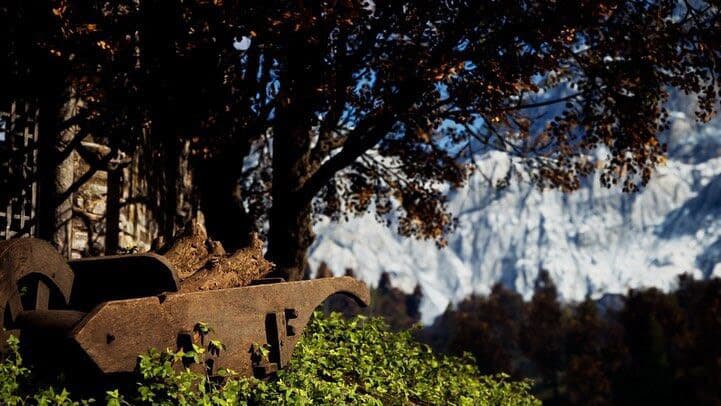 Unreal Engine 5 render — A rusted cannon under autumn trees, snow peaks behind