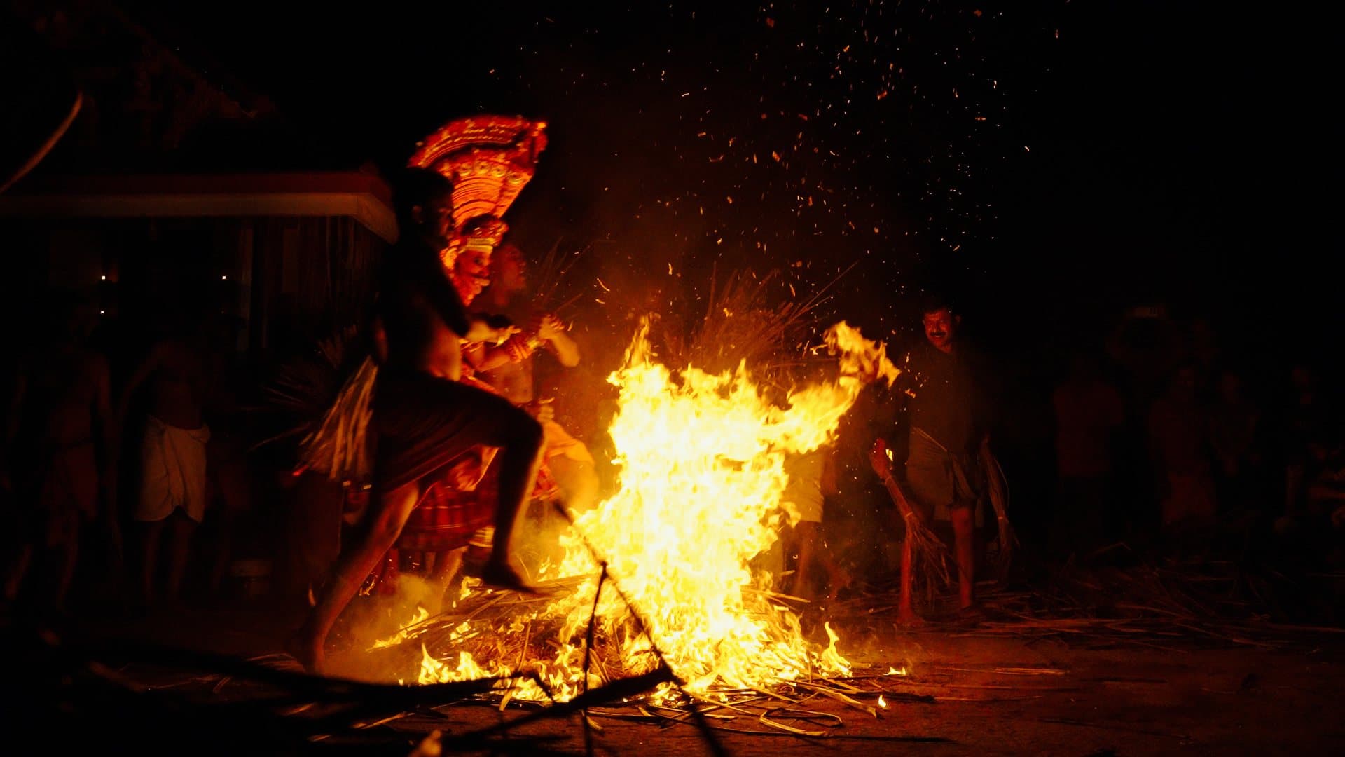 Theyyam — The performer running through the fire